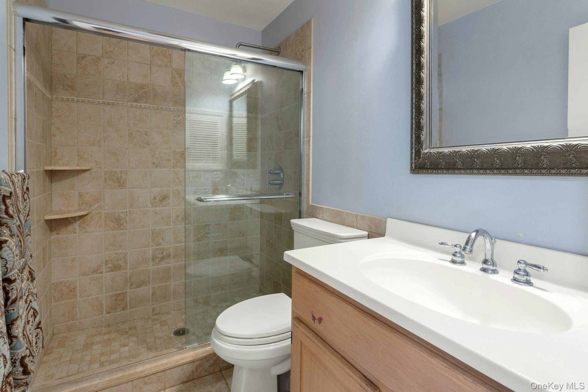 90 Cushman Road Patterson, NY 12563 - Photo 28 of 40 a bathroom with a sink and a mirror