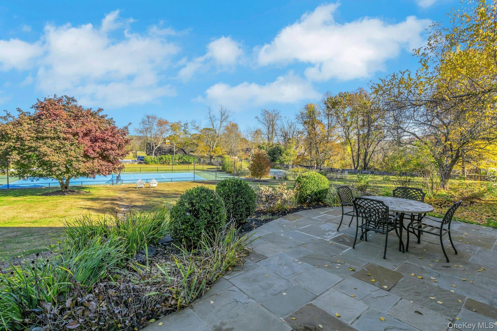 90 Cushman Road Patterson, NY 12563 - Photo 30 of 40 a view of a lake with a table and chairs