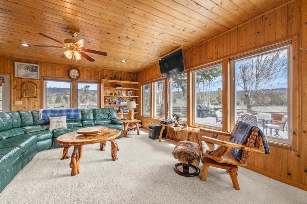 47477 Gerber Road Bonanza, OR 97623 - Photo 41 of 63 a living room with furniture a fireplace and large windows