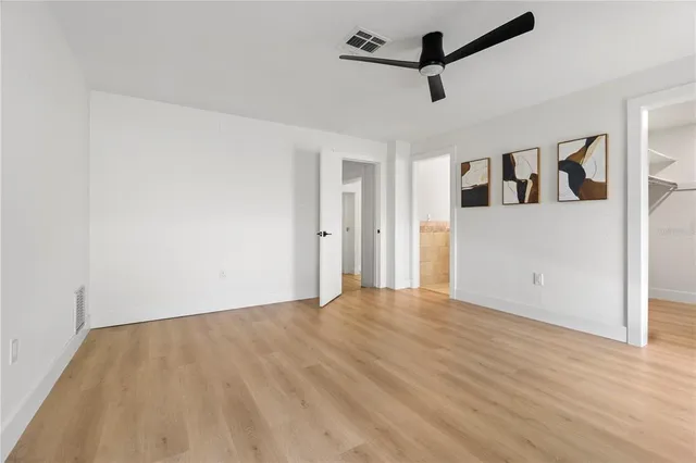 a view of a room with wooden floor