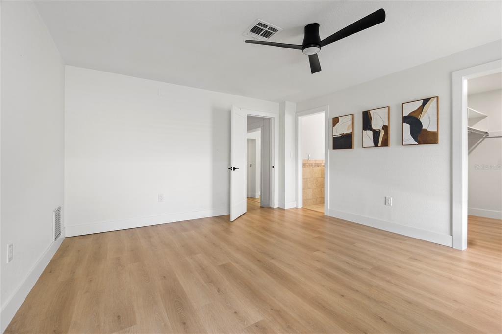 565 Sandy Hook Road Palm Harbor, FL 34683 - Photo 17 of 33 a view of a room with wooden floor