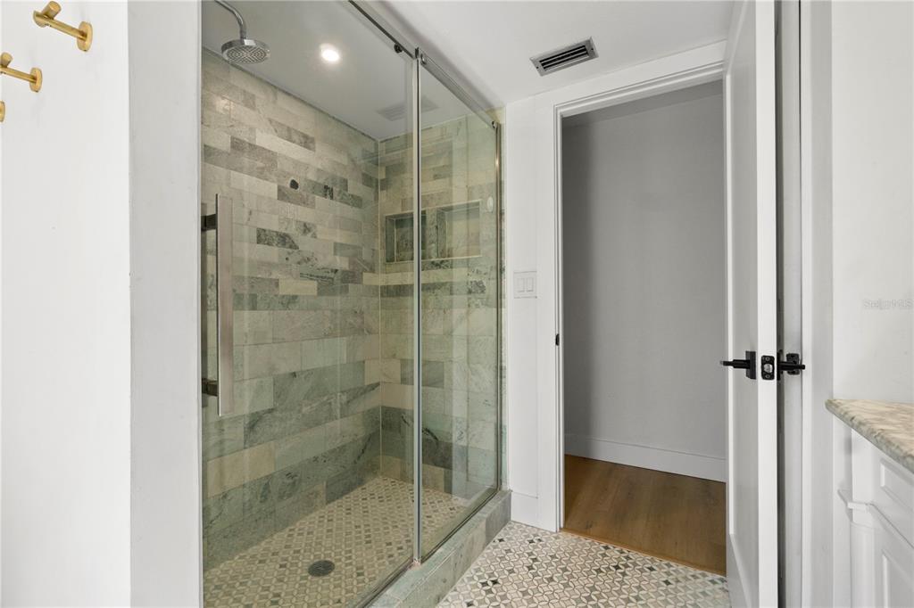 565 Sandy Hook Road Palm Harbor, FL 34683 - Photo 22 of 33 a bathroom with a shower and a sink