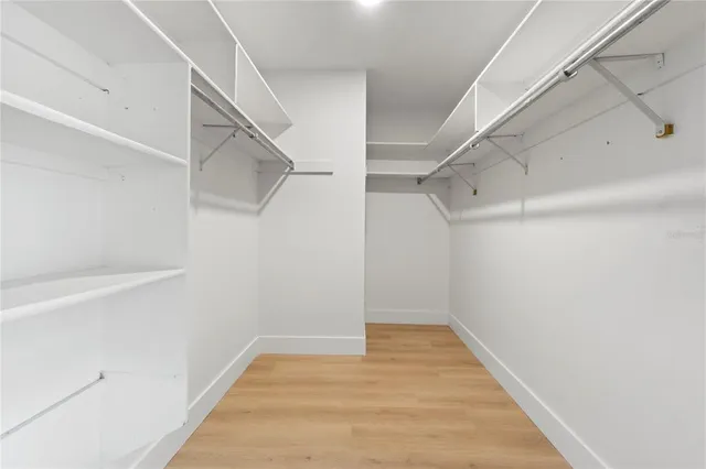 a view of an empty walk in closet
