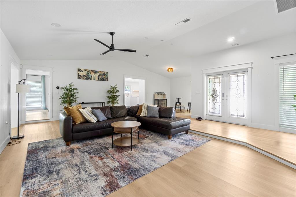 565 Sandy Hook Road Palm Harbor, FL 34683 - Photo 9 of 33 a living room with furniture or couch and a window