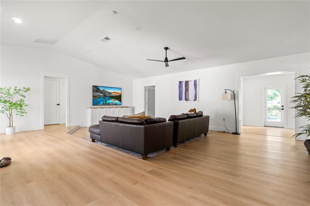 565 Sandy Hook Road Palm Harbor, FL 34683 - Photo 10 of 33 a living room with furniture and a wooden floor