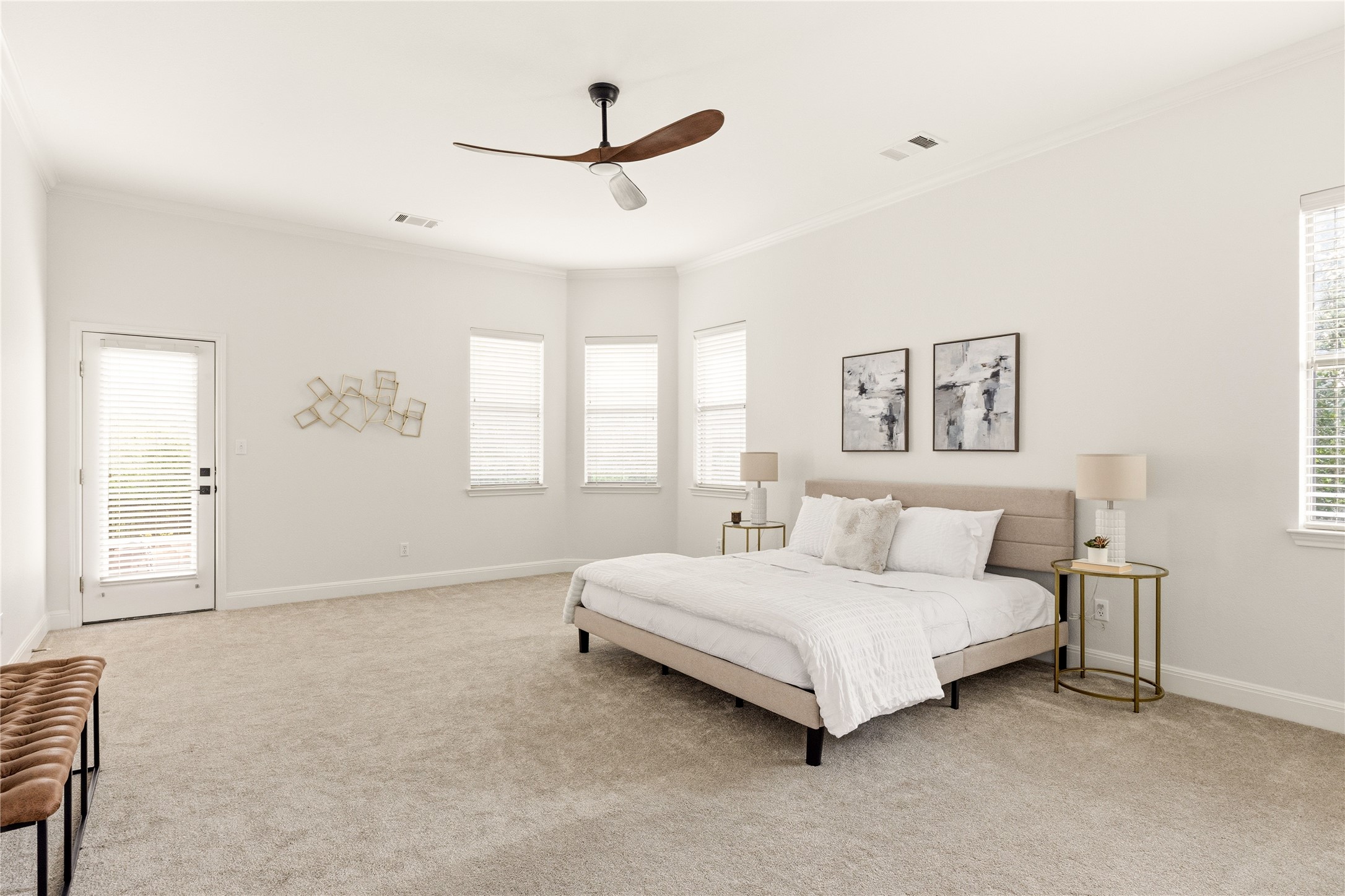1432 Tom Sawyer Road Austin, TX 78737 - Photo 17 of 33 A well-lit primary bedroom offers high ceilings and soft carpeting, creating a serene personal retreat.