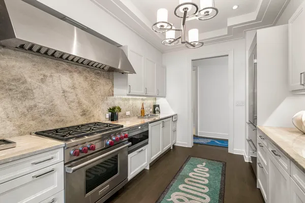 a kitchen with stainless steel appliances granite countertop a sink and cabinets