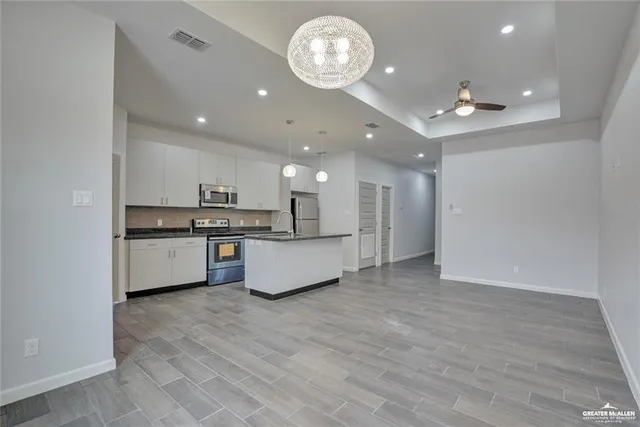 a view of a potted plant in front of a bathroom
