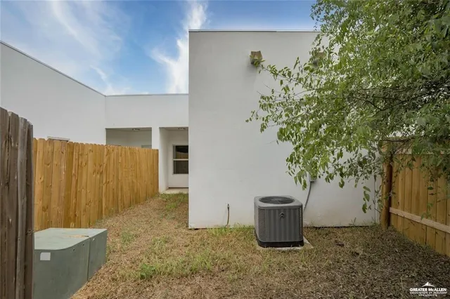 an empty room with a window and a mirror