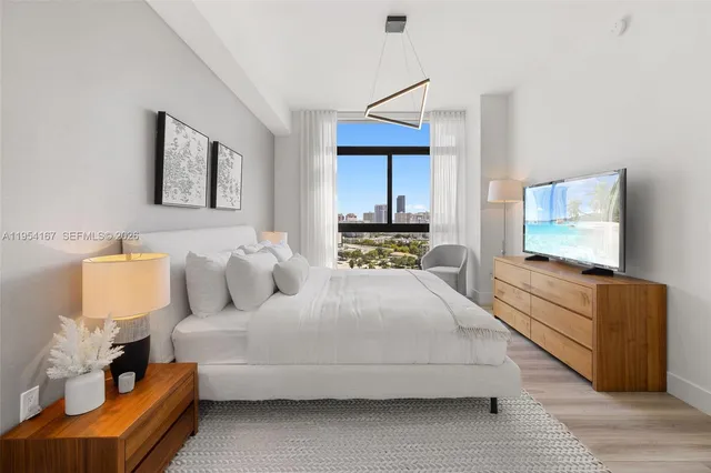 a bathroom with a double vanity sink toilet mirror and shower