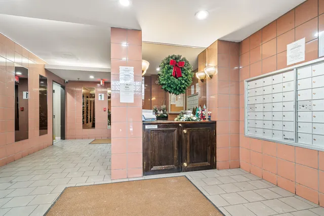 a view of entryway with a flower pot and a bookshelf