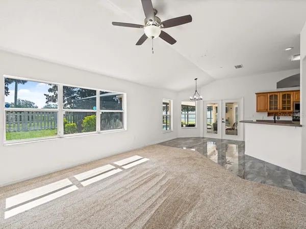 a view of livingroom with hardwood floor and ceiling fan
