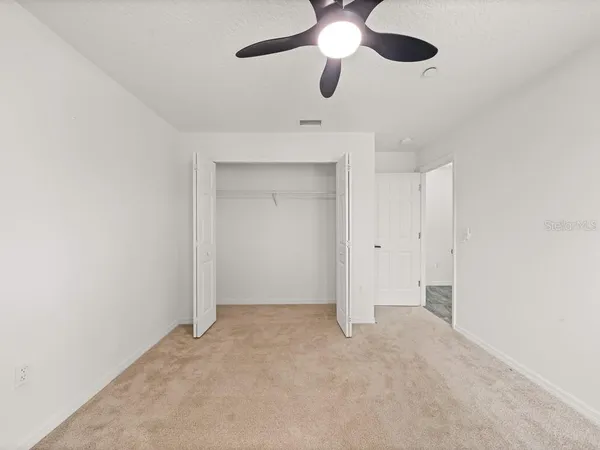 a view of hallway with wooden floor