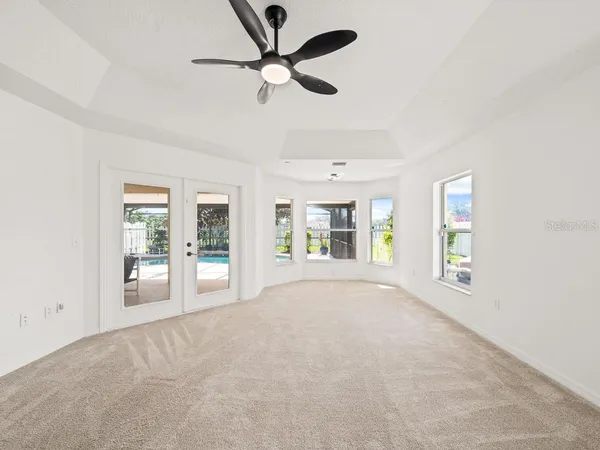 a view of an empty room with a window