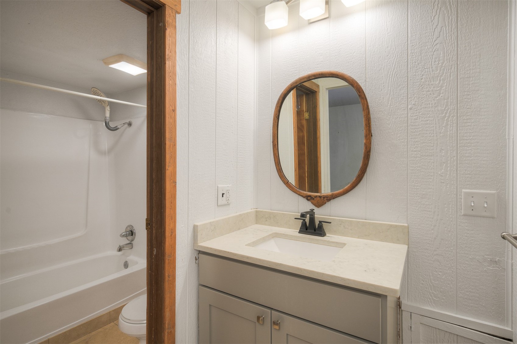 132 Illinois Gulch Road, Unit 3 Breckenridge, CO 80424 - Photo 10 of 32 a bathroom with a sink a vanity and a mirror