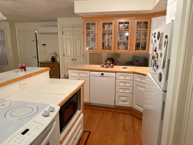 a view of a kitchen with a sink a refrigerator and a stove