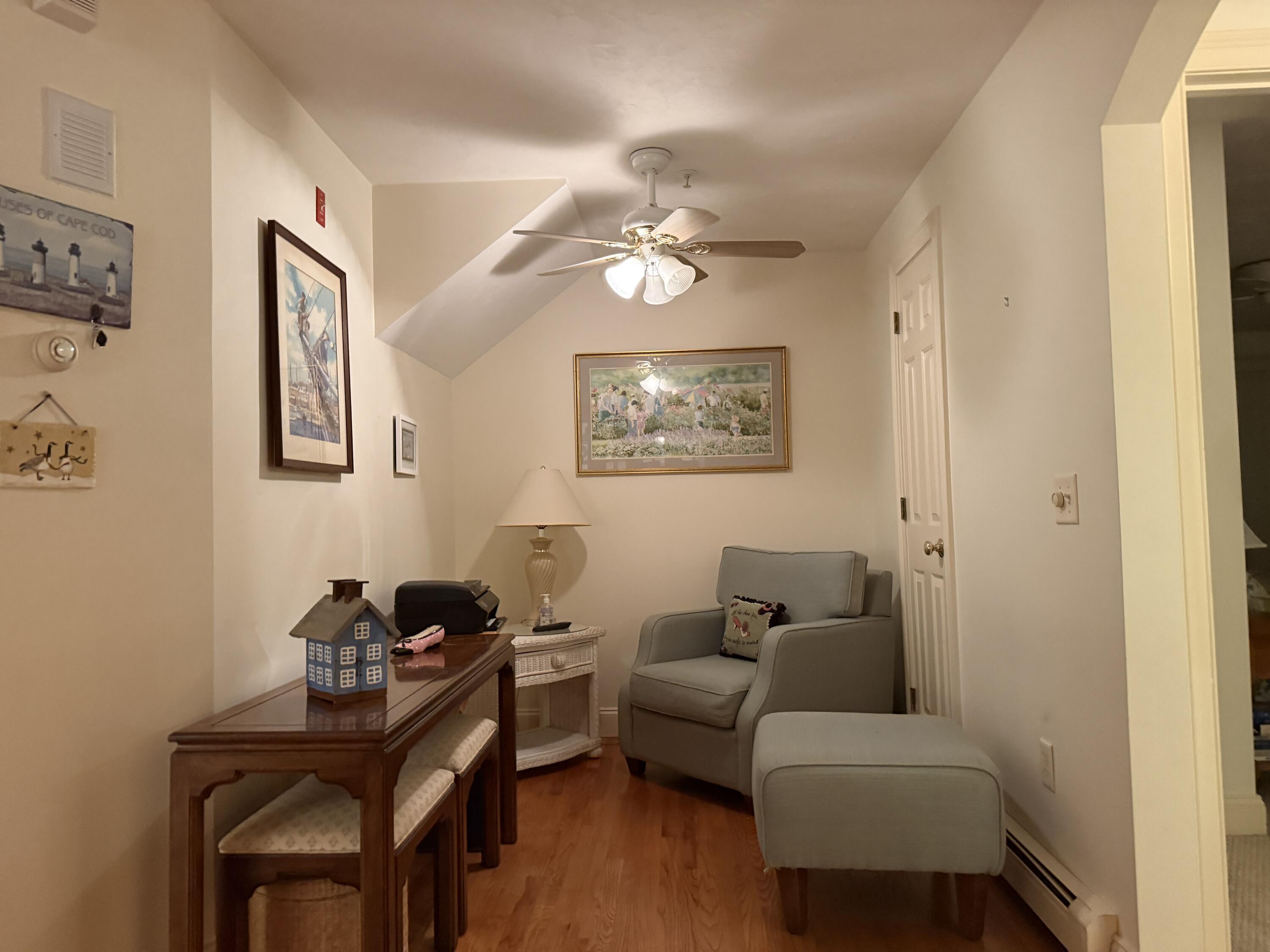 403 Lower County Road, Unit A Harwich Port, MA 02646 - Photo 8 of 12 a living room with furniture and a window