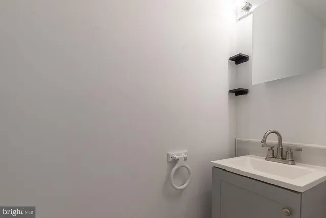 a bathroom with a sink and mirror