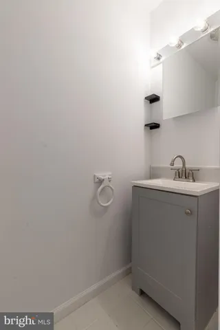 a bathroom with a sink and vanity