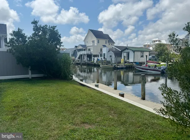 a view of a lake with a house in the background