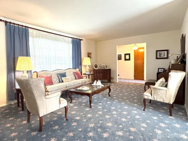 a living room with furniture and a table