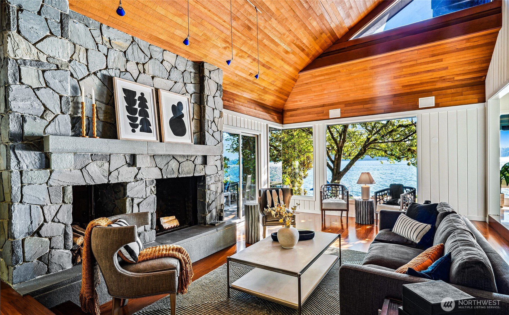 18 Holly Lane Mercer Island, WA 98040 - Photo 7 of 39 a living room with furniture a fireplace and a floor to ceiling window