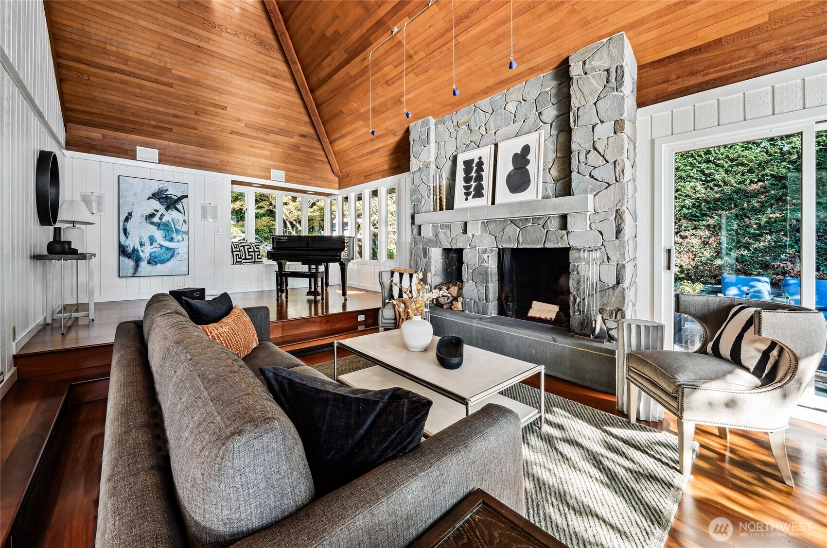 18 Holly Lane Mercer Island, WA 98040 - Photo 8 of 39 a view of a patio with couches chairs and a fireplace