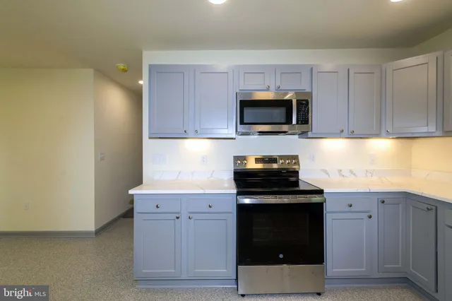 a kitchen with a sink and refrigerator