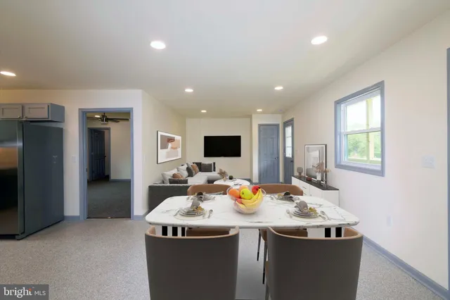 a view of a big room with a kitchen