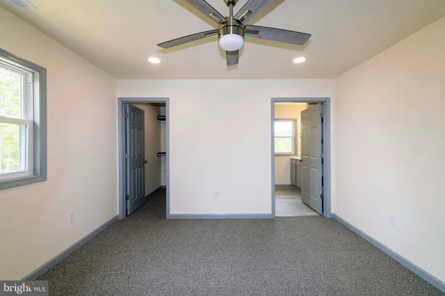 a bathroom with a tub and a sink