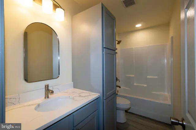 a view of a hallway with two rooms