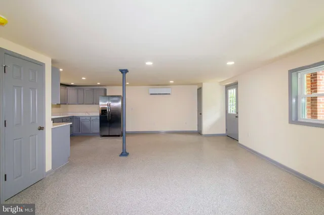 a kitchen with a sink and refrigerator