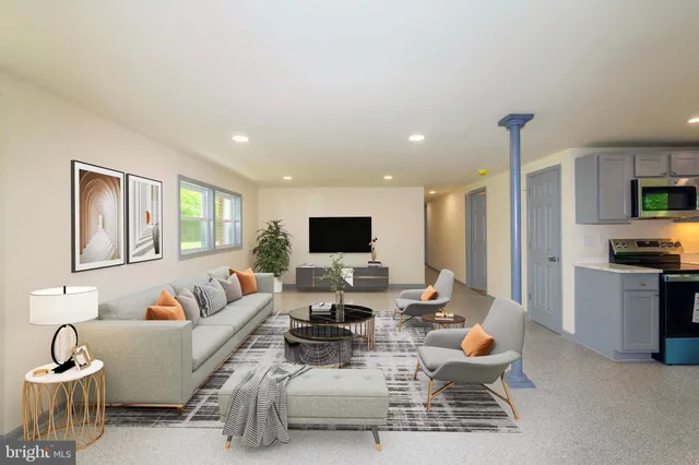 a large kitchen with a stove a sink dishwasher a refrigerator and a microwave