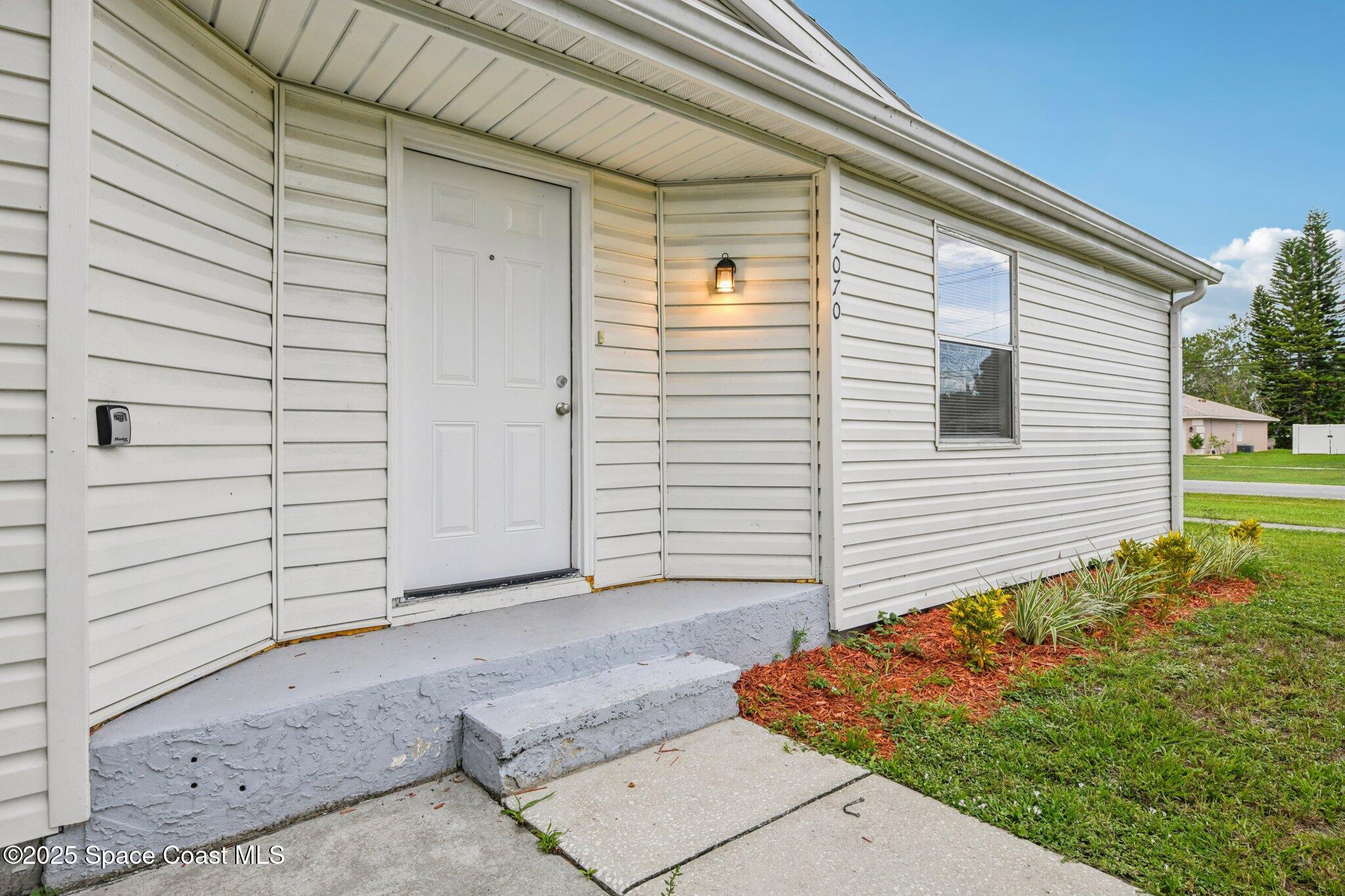 7070 Bismark Road Cocoa, FL 32927 - Photo 4 of 38 a view of a house with backyard