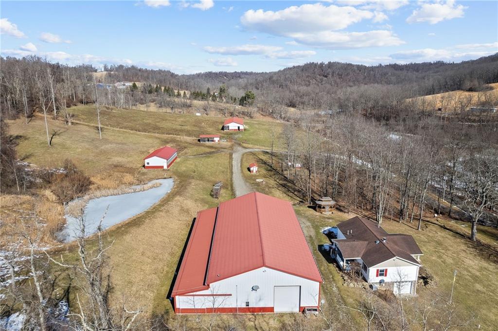 185 Dutch Glory Road Amity, PA 15311 - Photo 29 of 50 From left side of property. Home, Multi-purpose bulding and pond