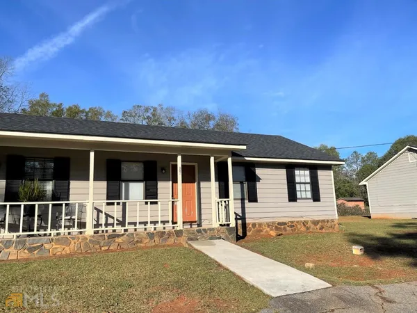 front view of a house with a patio