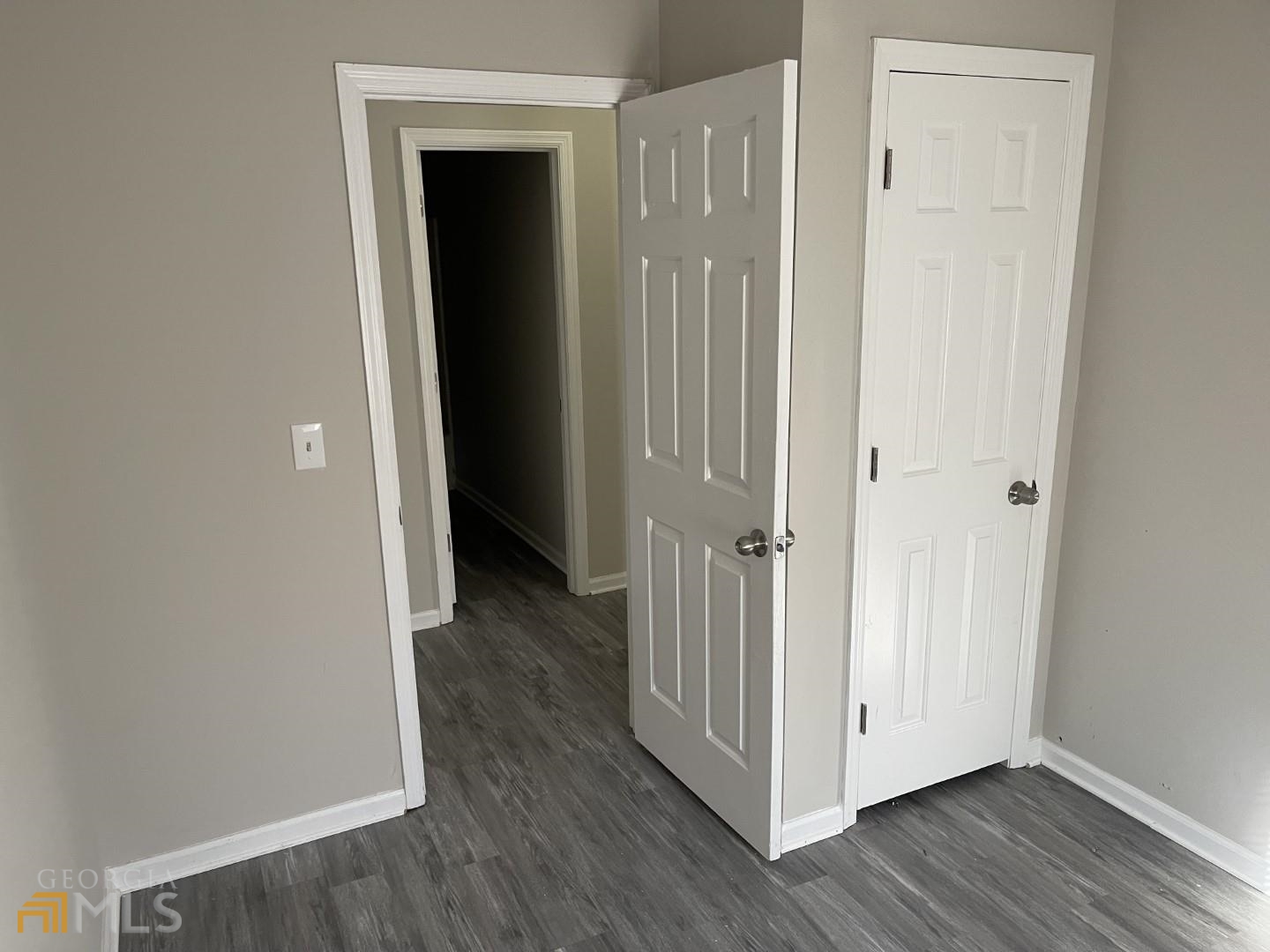 307 Pelly Avenue, Unit 307 Griffin, GA 30223 - Photo 13 of 16 a view of a hallway with wooden floor