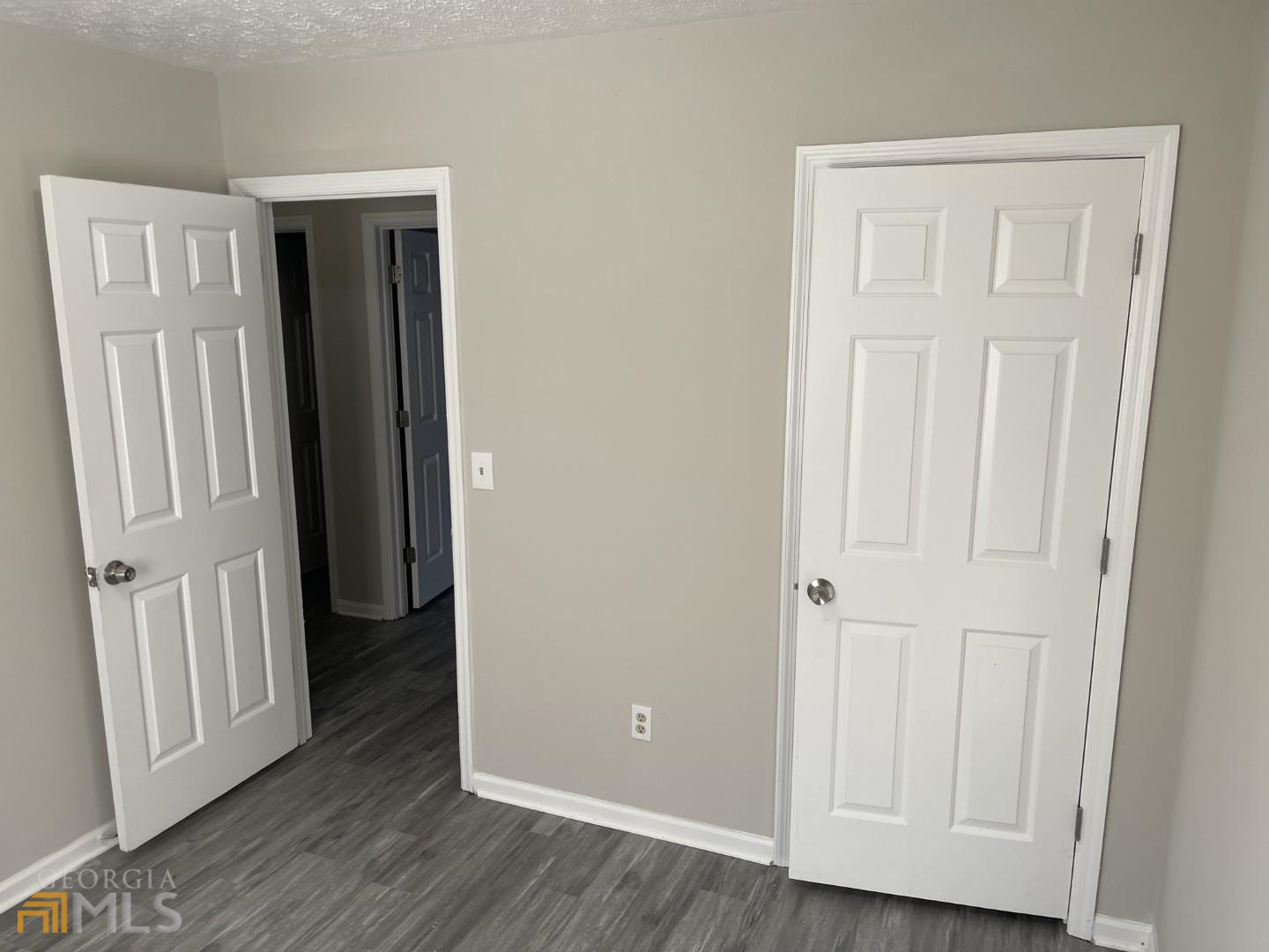 307 Pelly Avenue, Unit 307 Griffin, GA 30223 - Photo 16 of 16 an entryway with wooden floor and closet area