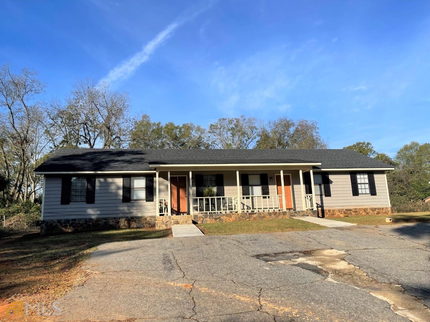 307 Pelly Avenue, Unit 307 Griffin, GA 30223 - Photo 2 of 16 a front view of a house with a yard