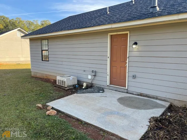 a backyard of a house with seating space