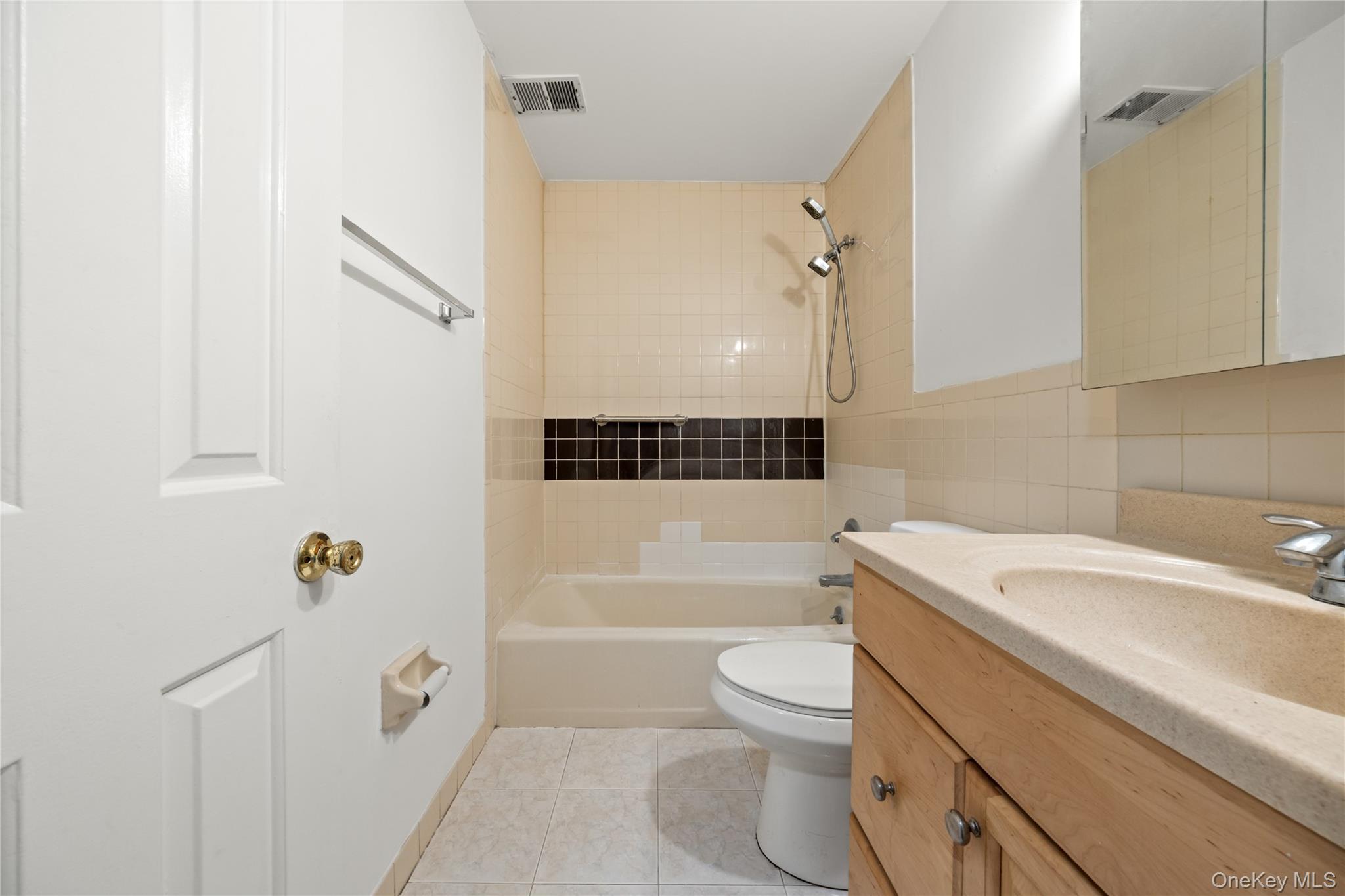 402 Kennedy Drive Spring Valley, NY 10977 - Photo 14 of 26 a bathroom with a sink a toilet and shower