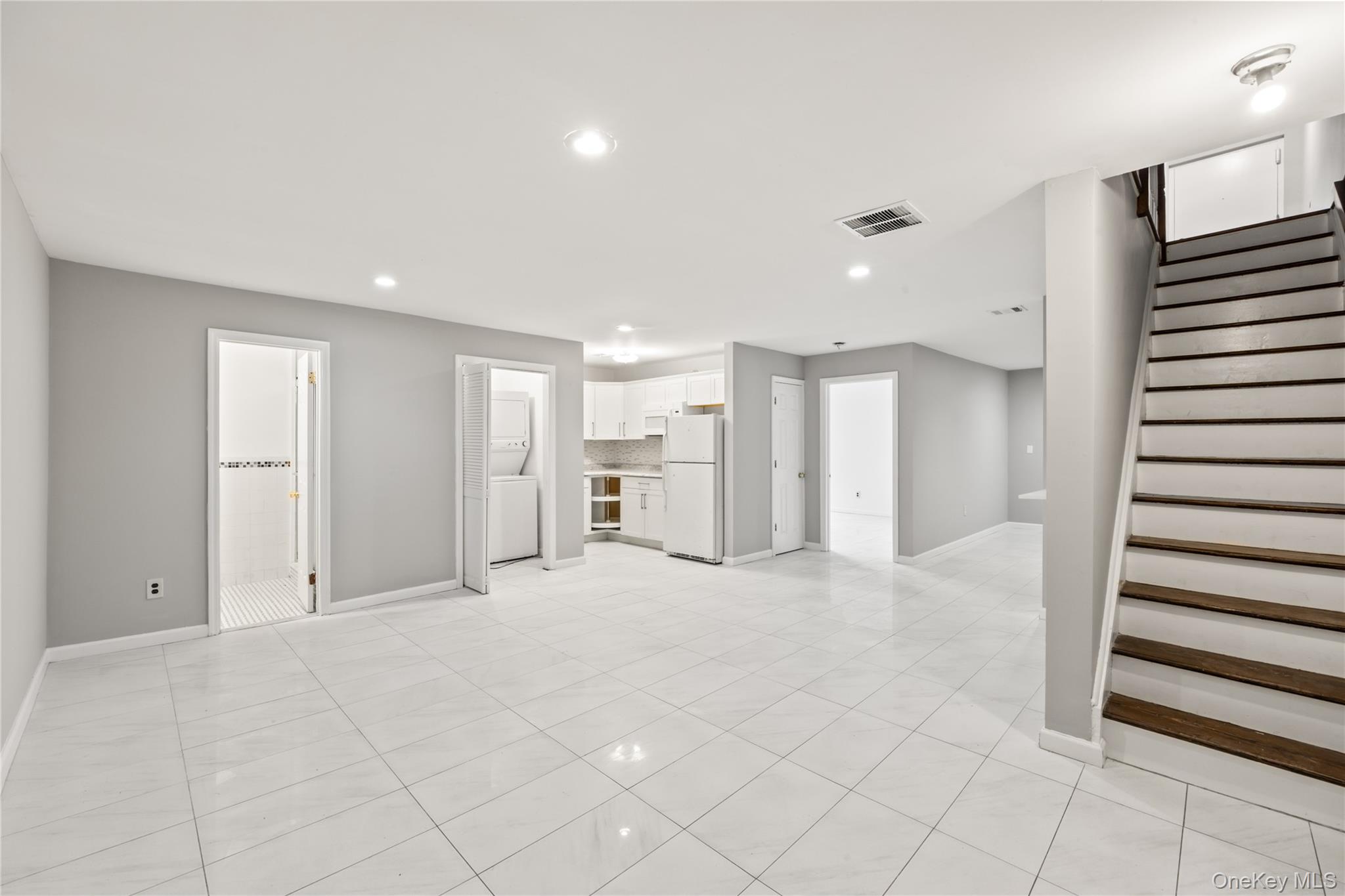 402 Kennedy Drive Spring Valley, NY 10977 - Photo 16 of 26 a view of an empty room with a kitchen