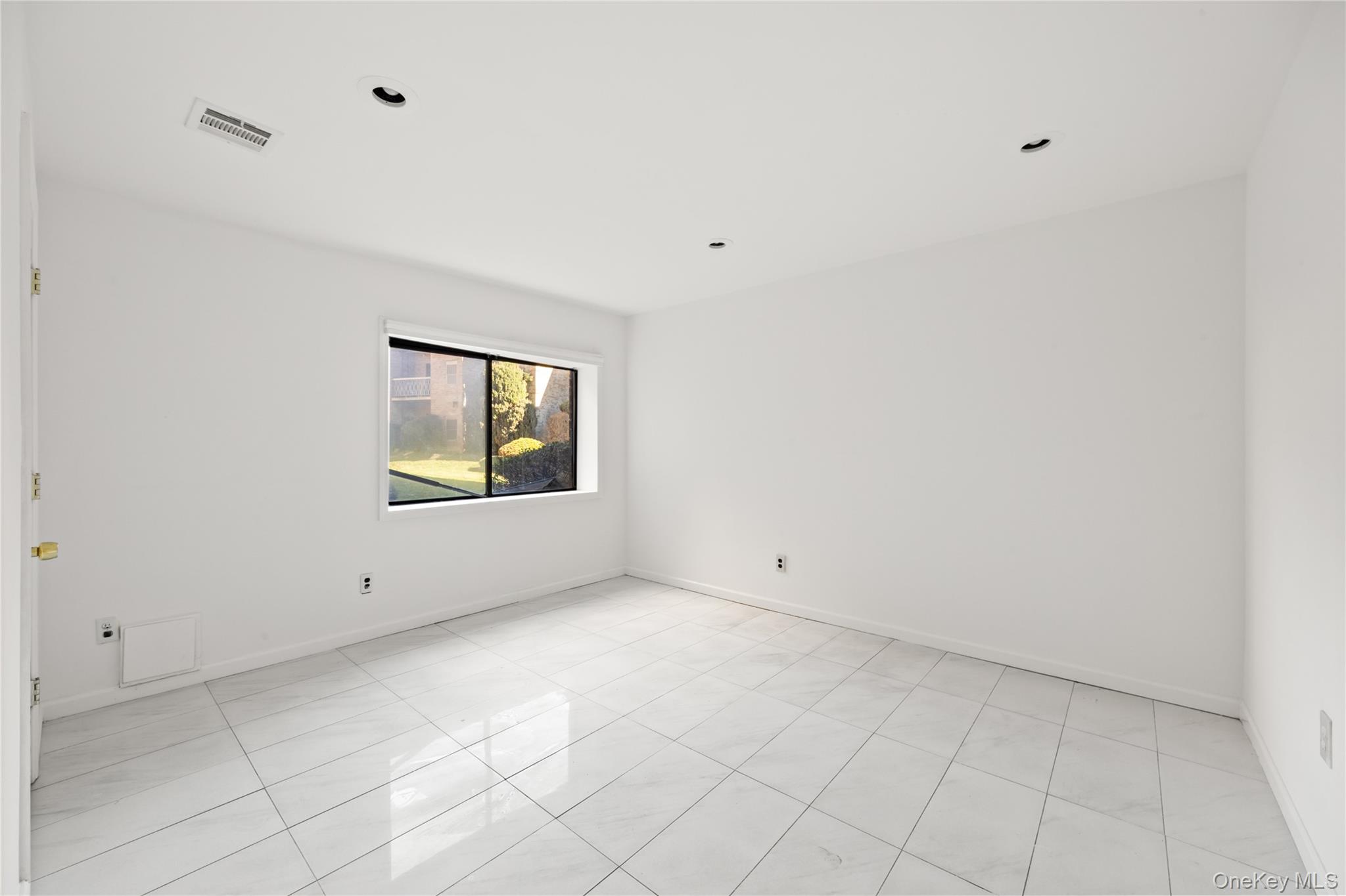 402 Kennedy Drive Spring Valley, NY 10977 - Photo 24 of 26 a view of an empty room with a window