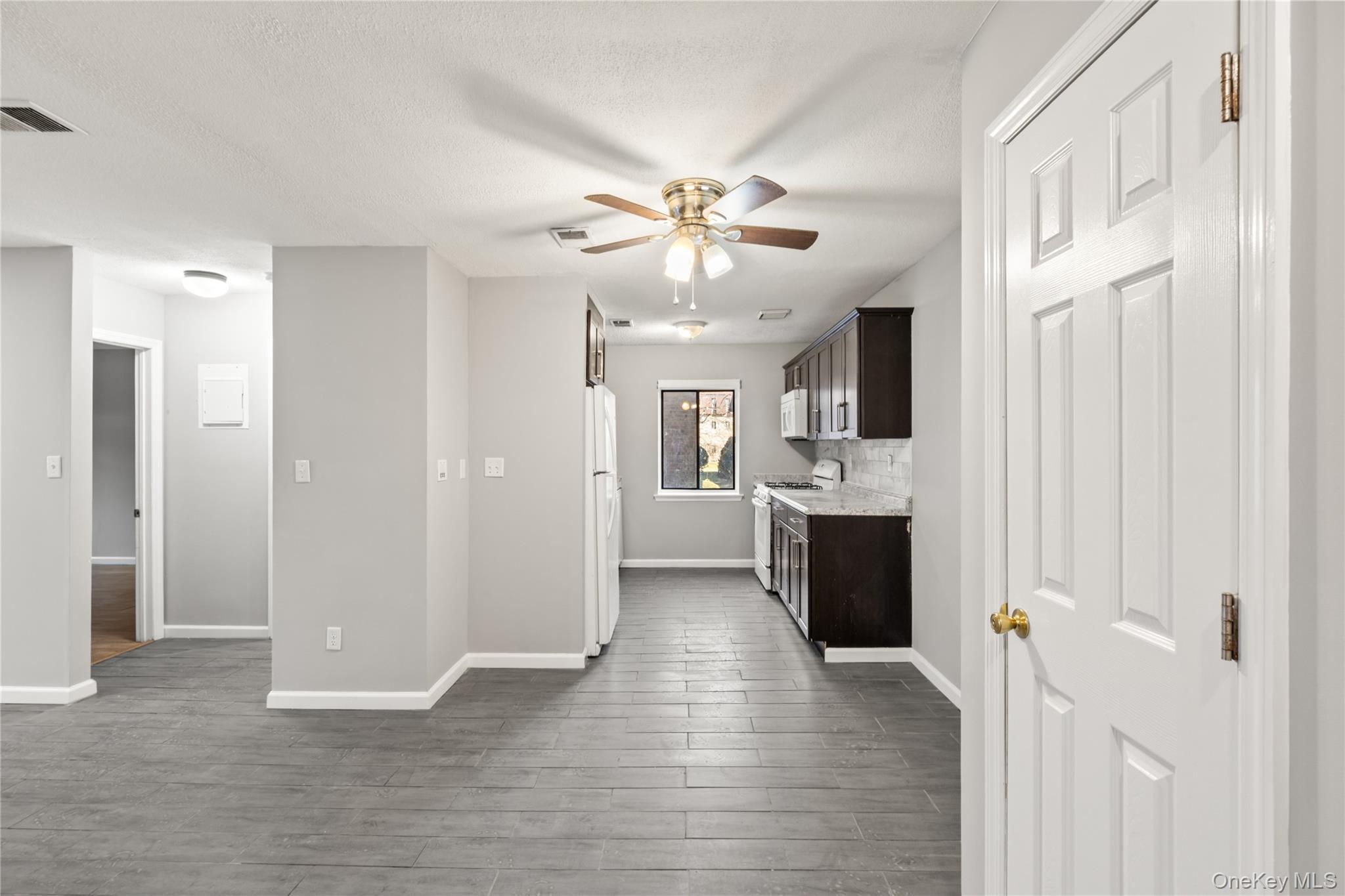 402 Kennedy Drive Spring Valley, NY 10977 - Photo 5 of 26 a view of a kitchen with a sink and a kitchen
