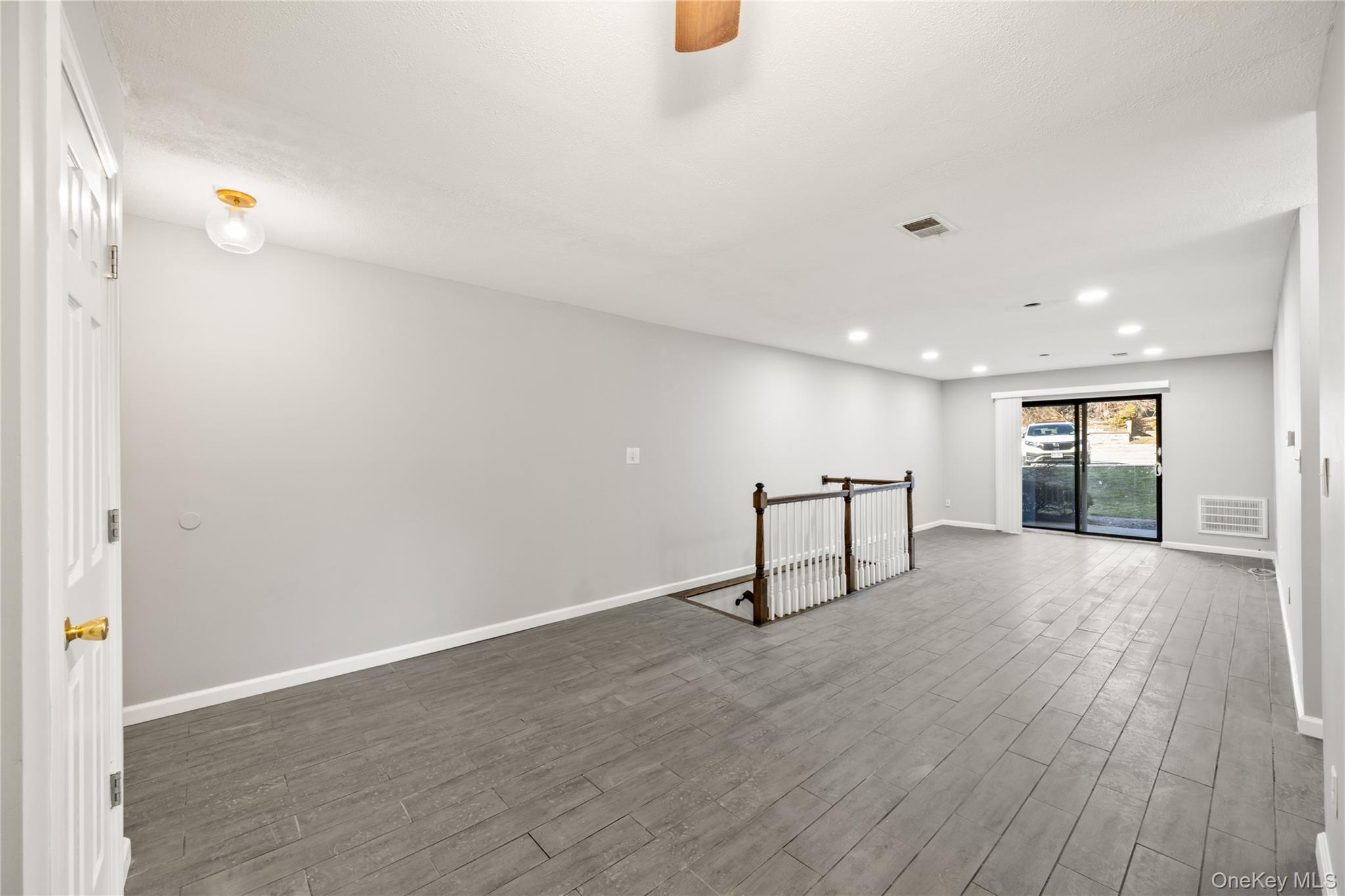 402 Kennedy Drive Spring Valley, NY 10977 - Photo 9 of 26 a view of an empty room and wooden floor