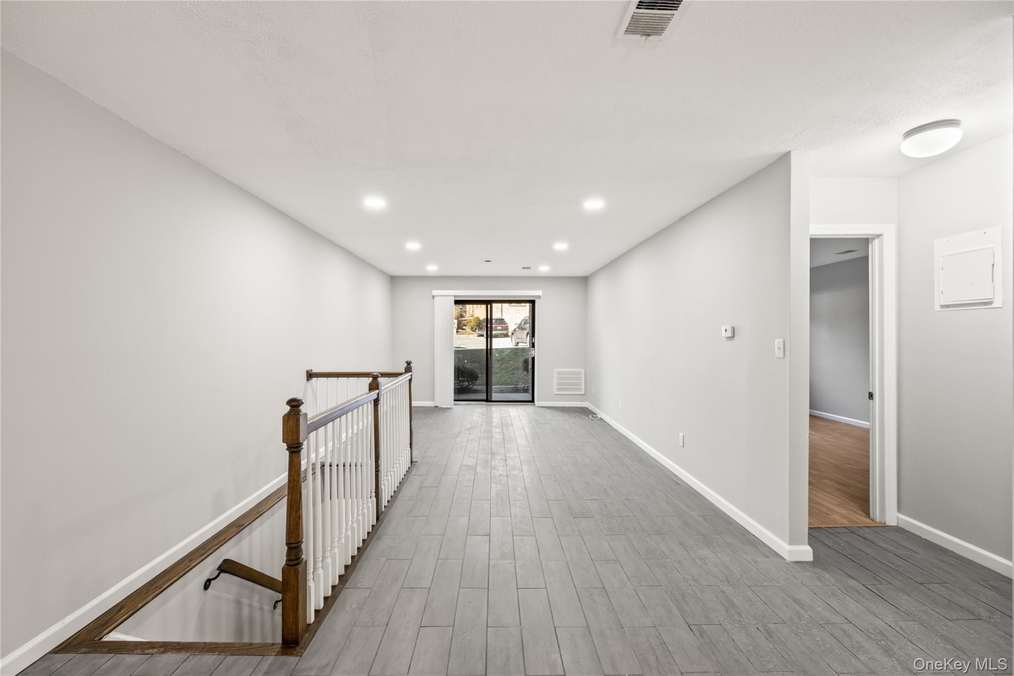 402 Kennedy Drive Spring Valley, NY 10977 - Photo 10 of 26 a view of a hallway with wooden floor