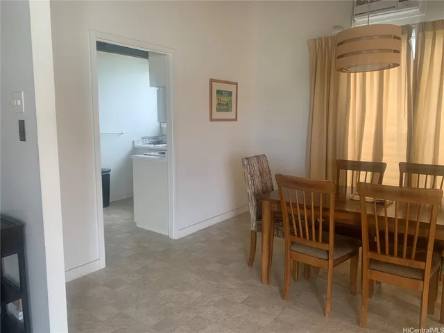 a view of a room with furniture and windows