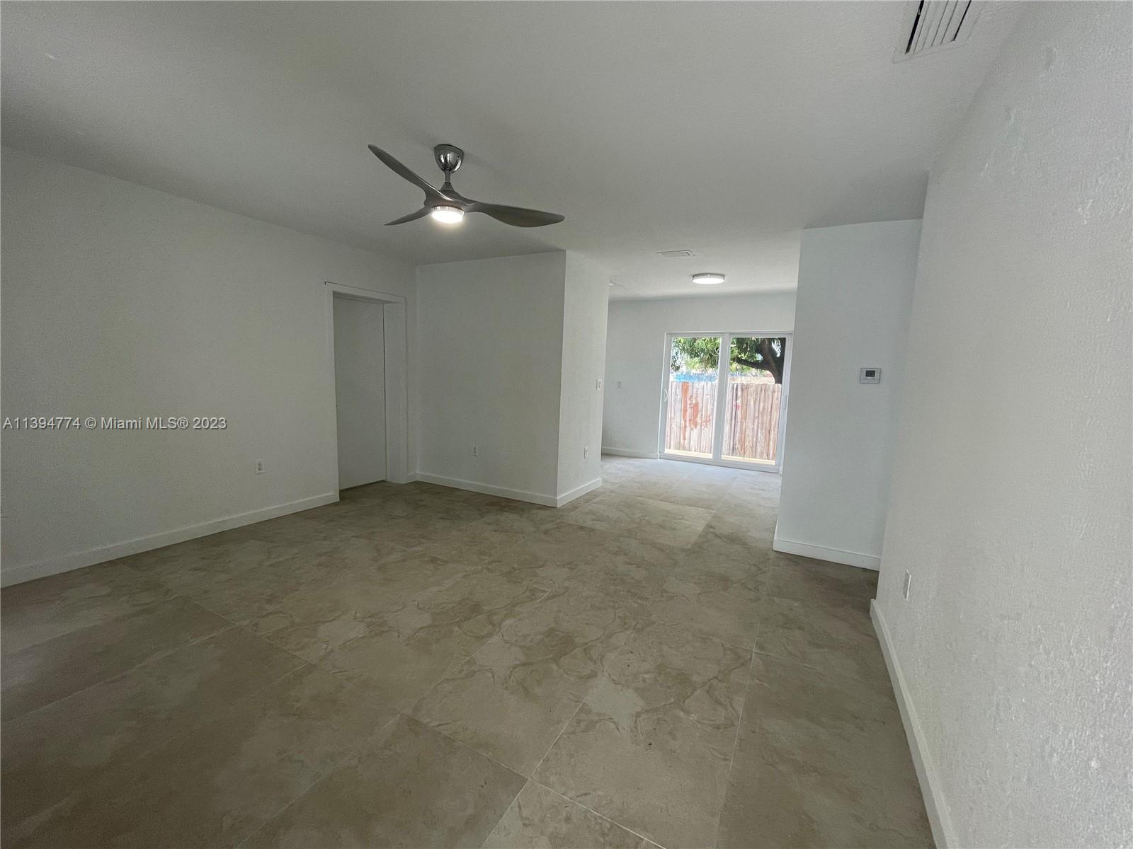 2607 Northwest 29th Street Miami, FL 33142 - Photo 4 of 13 a view of an empty room with a window