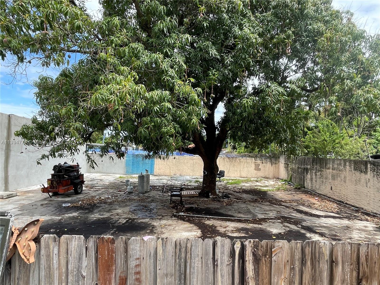 2607 Northwest 29th Street Miami, FL 33142 - Photo 5 of 13 a view of a yard with wooden fence