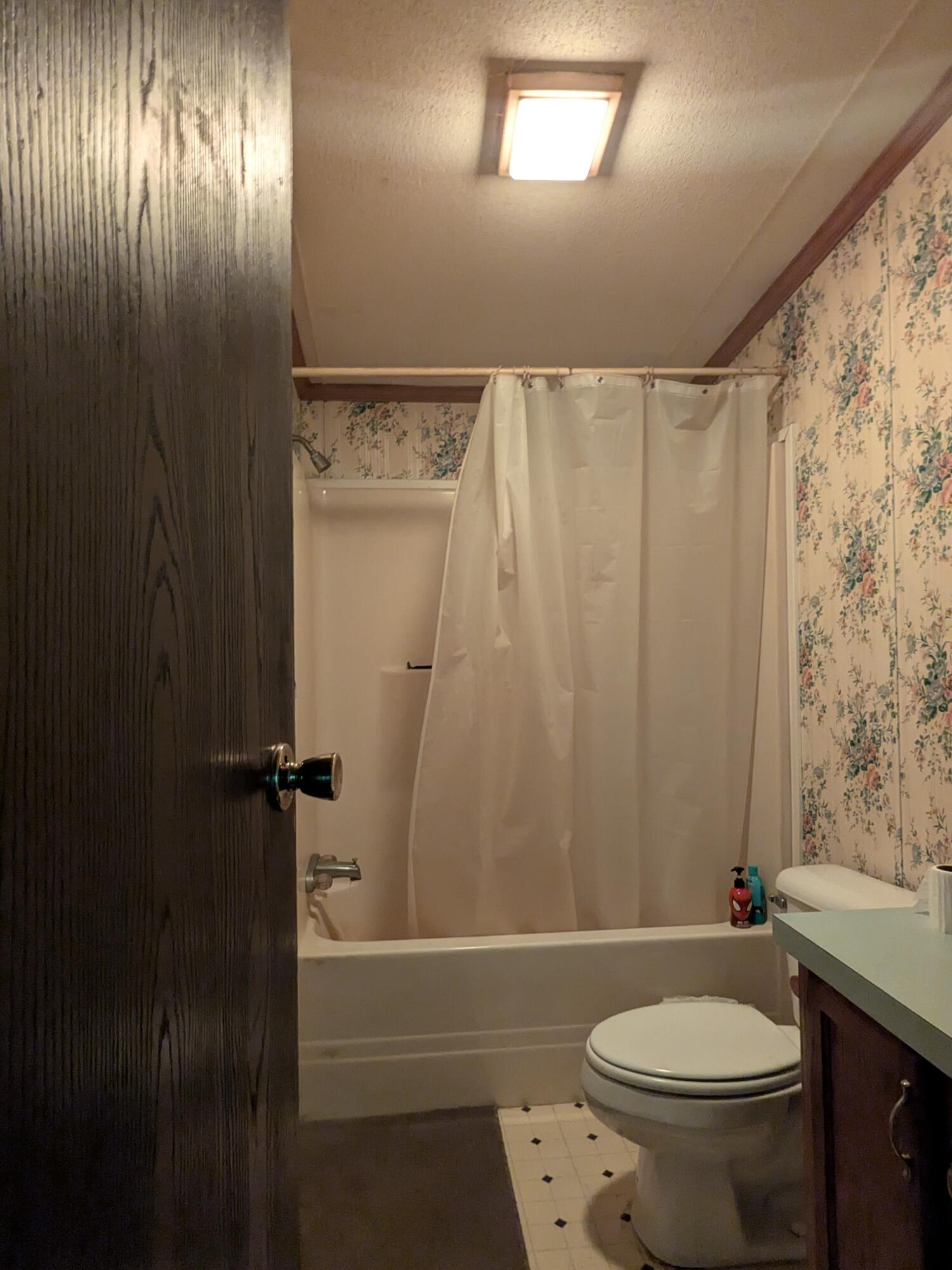 135 Weber Lane Gilbert, PA 18331 - Photo 6 of 9 a bathroom with a granite countertop toilet a sink and a bathtub